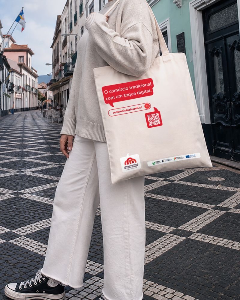 Tote bag do Bairro Comercial Digital, com balão de fala a destacar uma vantagem do bairro